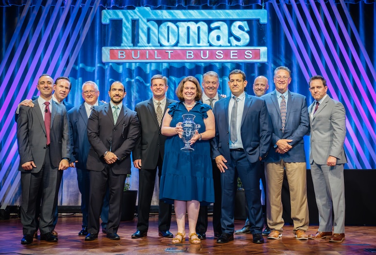 Daoud Chaaya (far left), Jeff Allen (second from left) and T.J. Reed (far right) of Thomas Built Buses recognizing the Carolina Thomas team as 2025 Dealer of the Year.